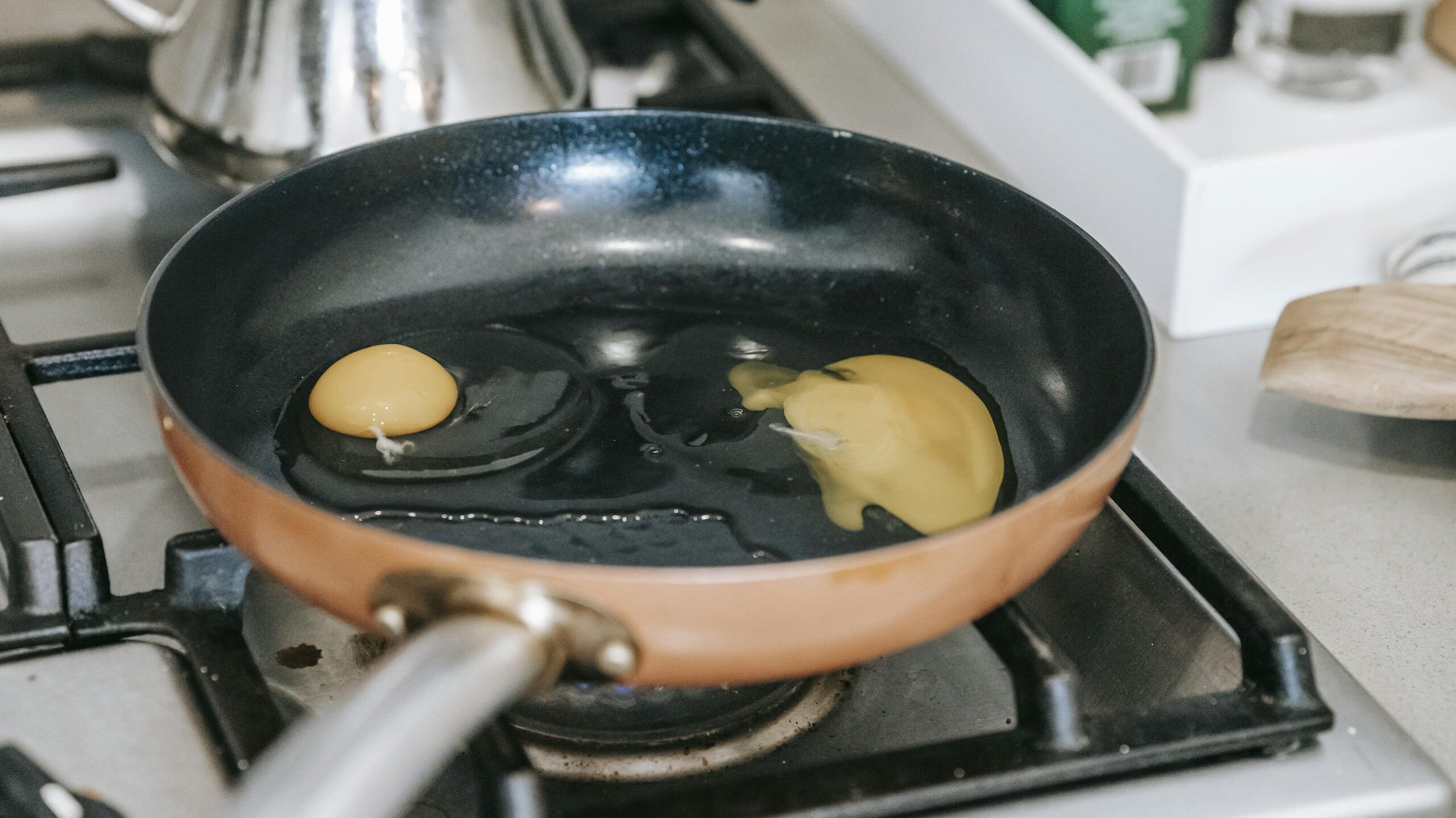 Eggs frying in pan on stove